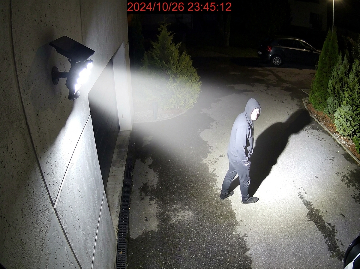 High-intensity dual LED security floodlights illuminating an unauthorized intruder